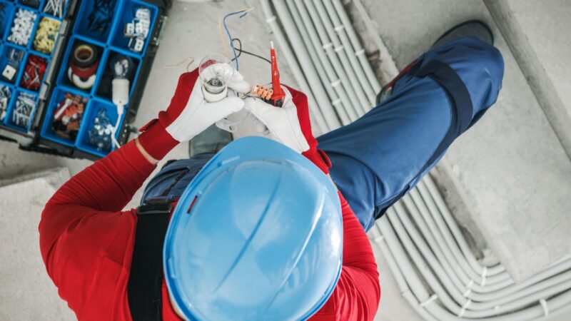 Electrician installing an electrical conduit